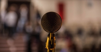 microphone in front of a blurred audience